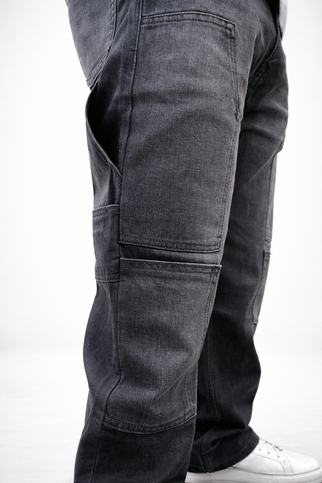 Charcoal grey cargo denim jeans close-up of knee panel and lower leg pocket