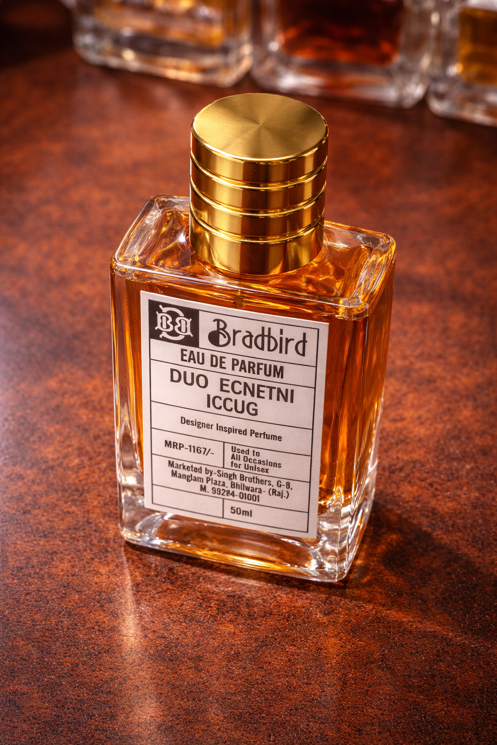 Square Eau de Parfum bottle with gold cap and amber liquid, label on front