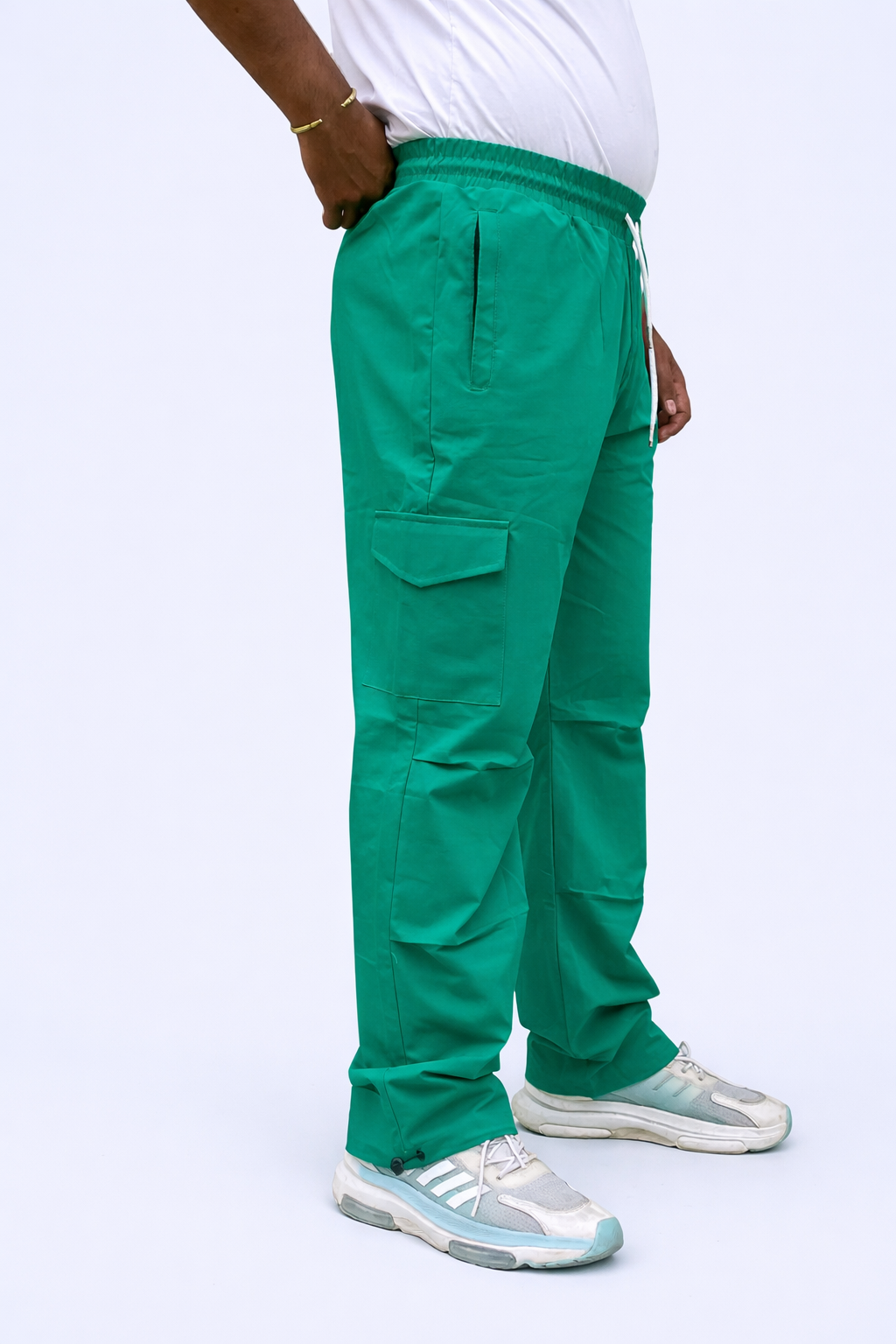 Green cargo joggers rear view with side pockets and adjustable ankle cuff