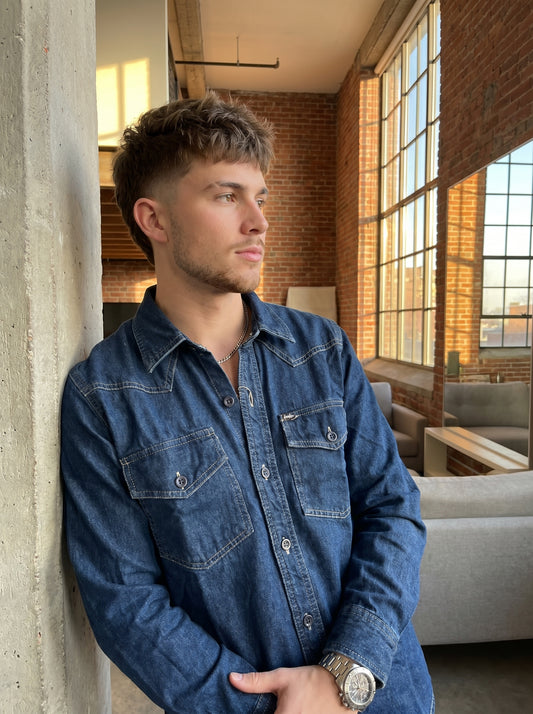 Blue denim western-style shirt with button placket and chest flap pockets