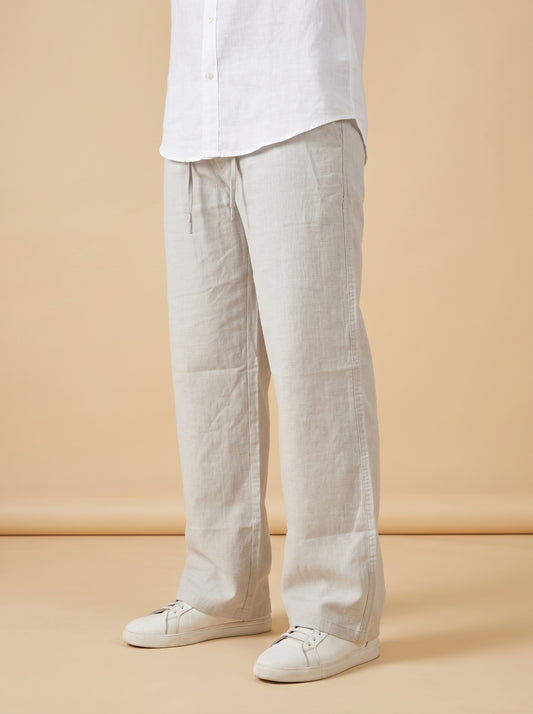 Relaxed linen-cotton trousers in light beige, straight legs with front seam details