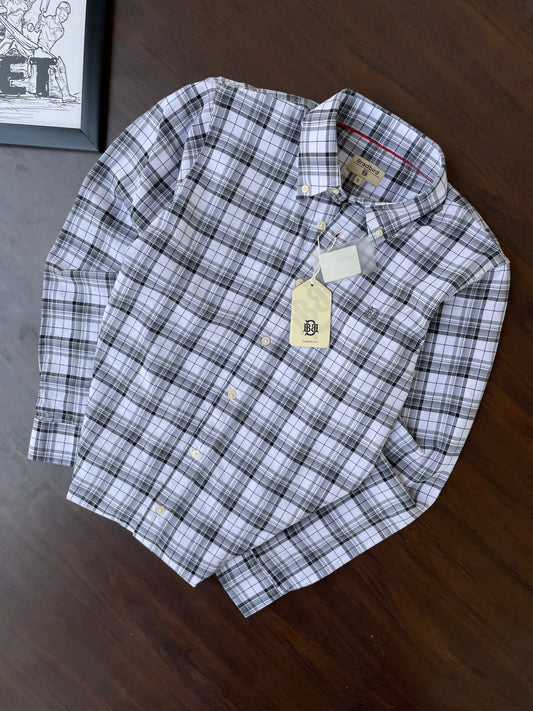 Folded black-and-white check button-up shirt with button-down collar