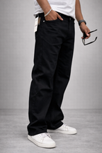 Men's jet black straight-fit jeans, side view with ankle-length hem