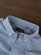 Sky blue micro-check shirt neckline with inner label and buttoned collar tips