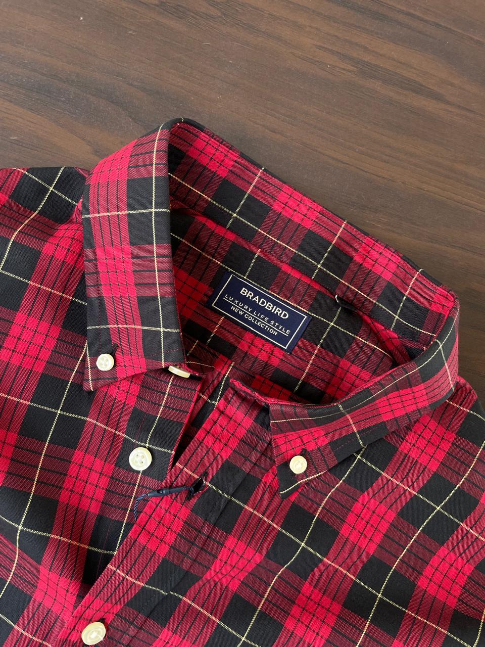 Red and black buffalo check shirt collar with inner label and white button details