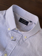 Light blue micro-check button-down shirt neckline and chest buttons with inner label
