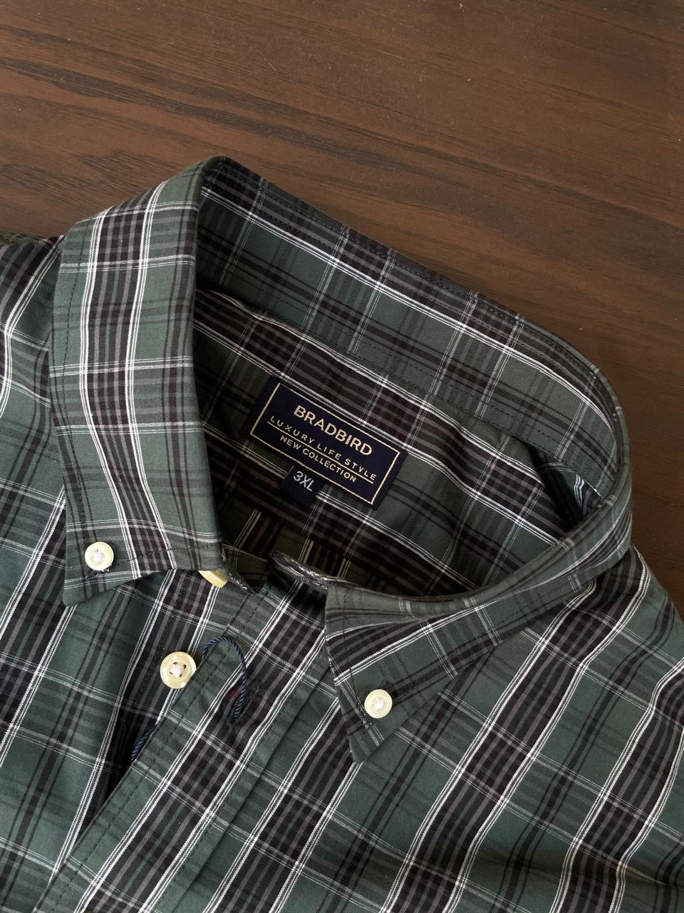 Bottle green tartan check collar and button placket with inner size label
