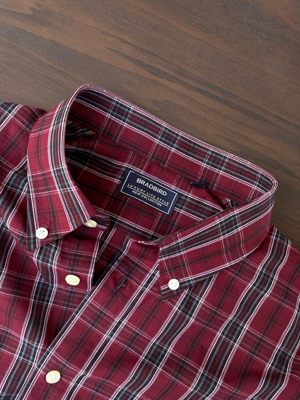 Maroon tartan check shirt inner collar label, button placket and white buttons