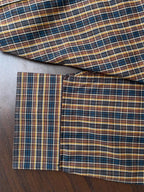 Hem and cuff detail on mustard & navy multi-check button-up shirt