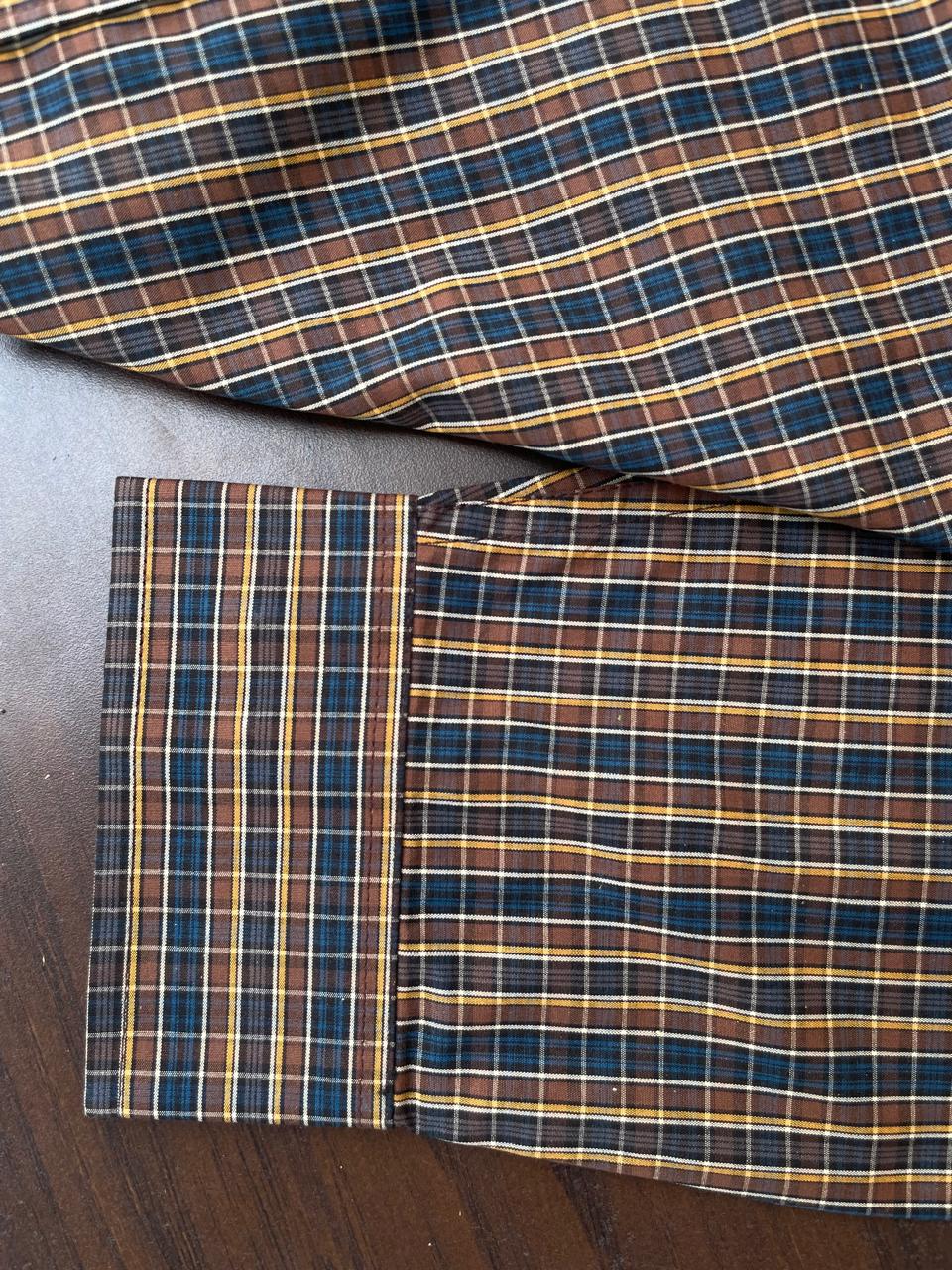 Hem and cuff detail on mustard & navy multi-check button-up shirt