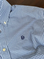Sky blue micro-check shirt chest area with embroidered logo and buttoned placket