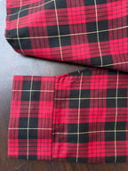 Red and black buffalo check cuffs and hem, button closure detail