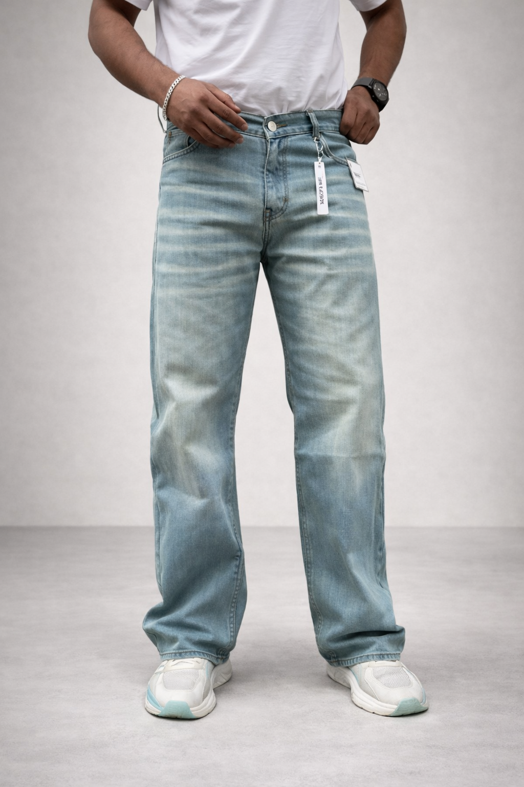 Light wash relaxed straight jeans, front view with drawcord/tie and size tag
