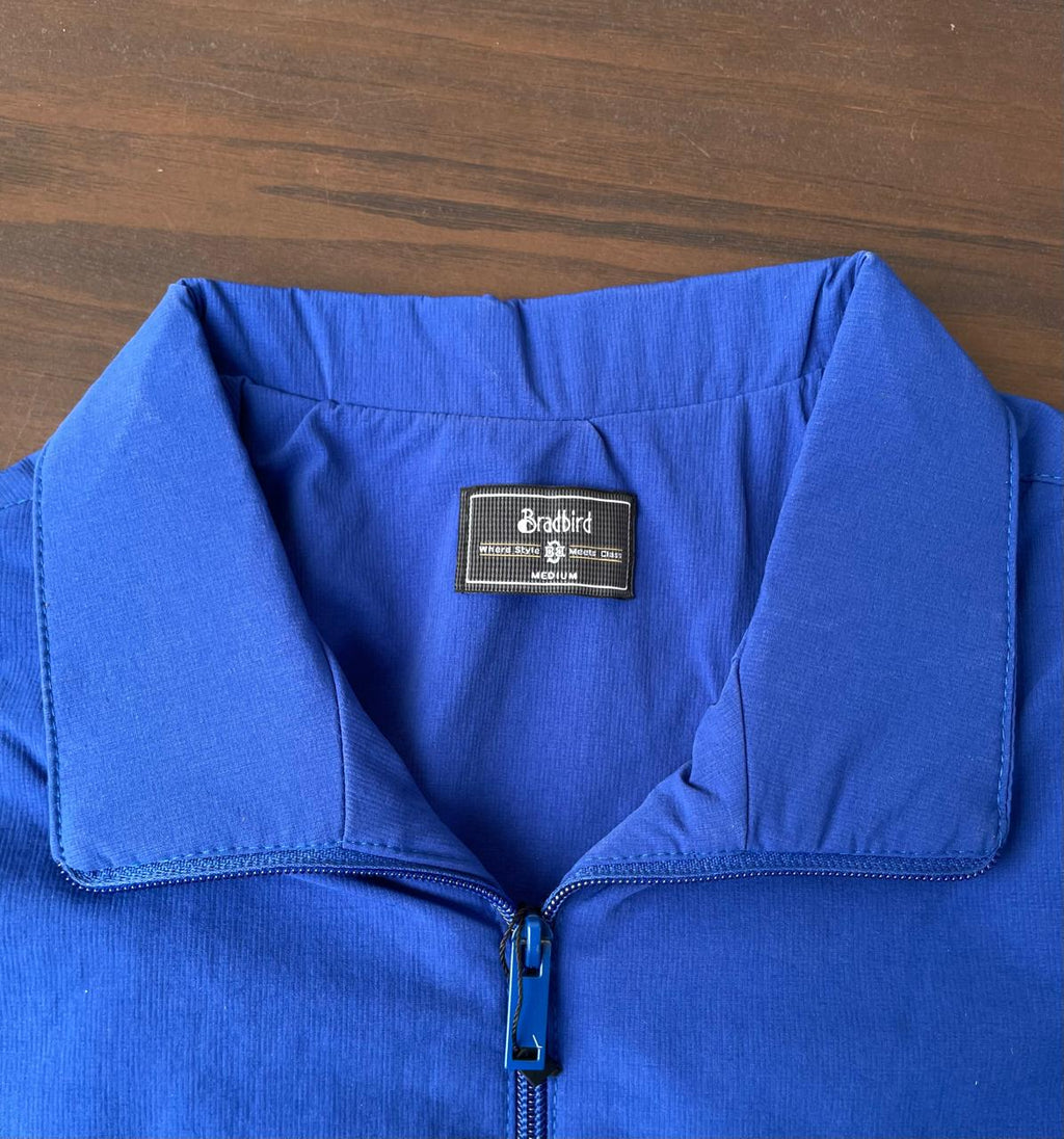 Windbreaker inner collar and size label; royal blue fabric with zip front view