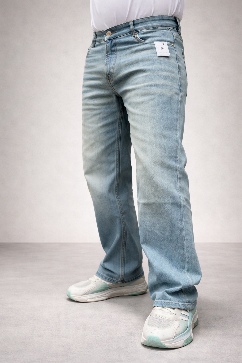 Light wash straight-fit jeans, side view with relaxed leg opening
