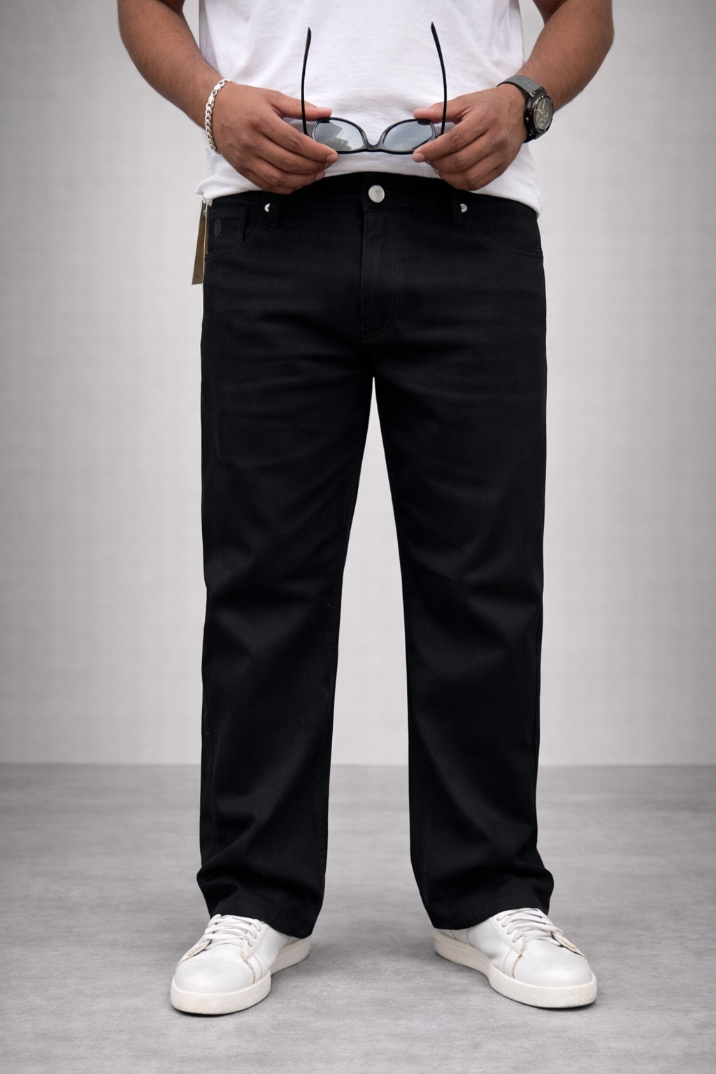 Men's jet black straight-fit jeans, front view with button closure