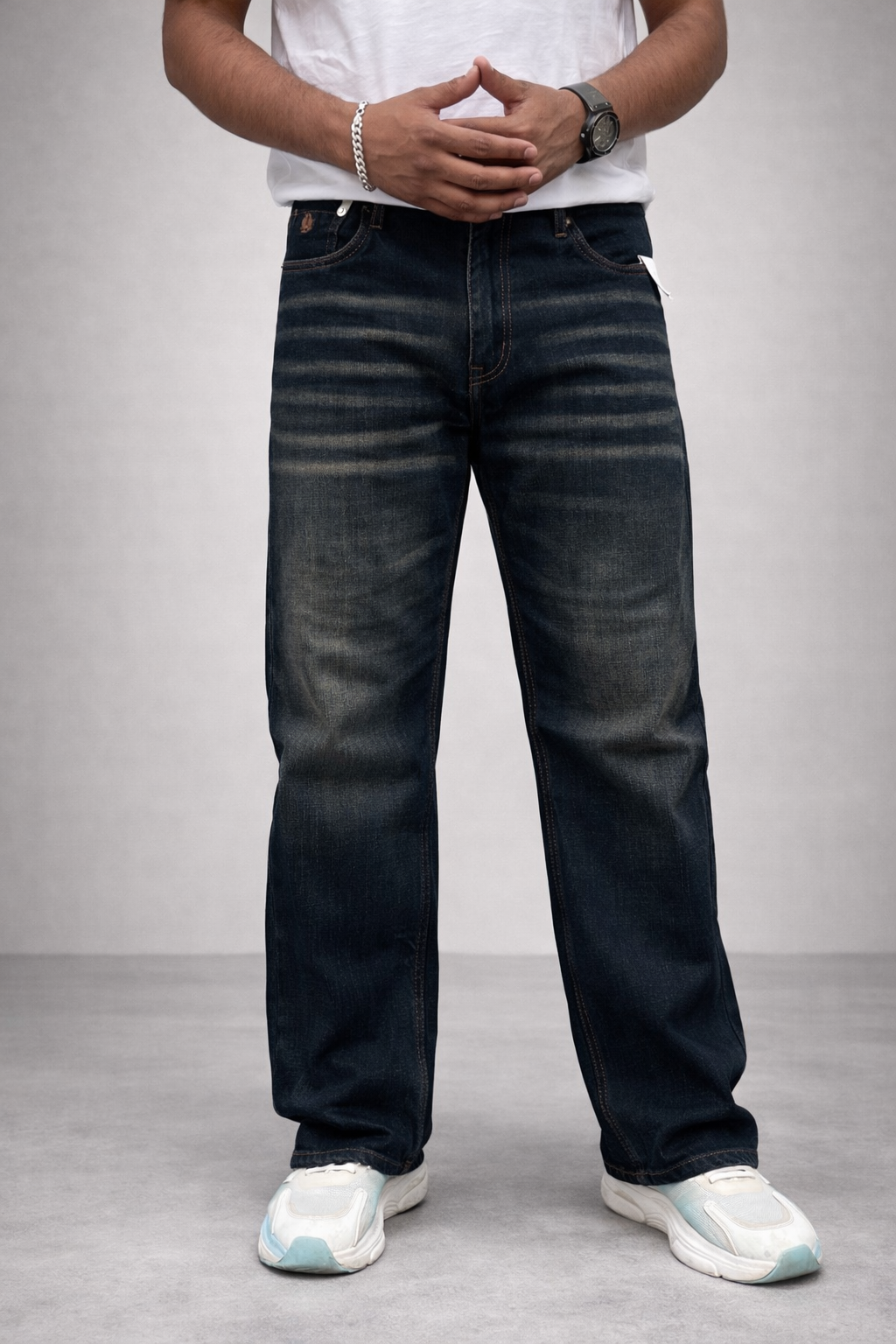 Dark indigo straight-fit jeans, front full-length: faded whisker stripes on legs.