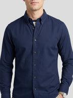 Textured oxford shirt front view, rich navy with tonal chest monogram