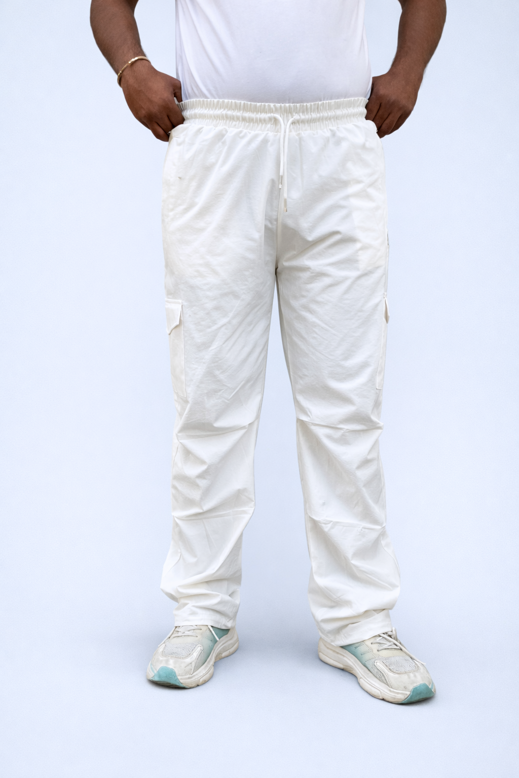 White cargo joggers front view with adjustable ankle drawcord and cargo pocket panels