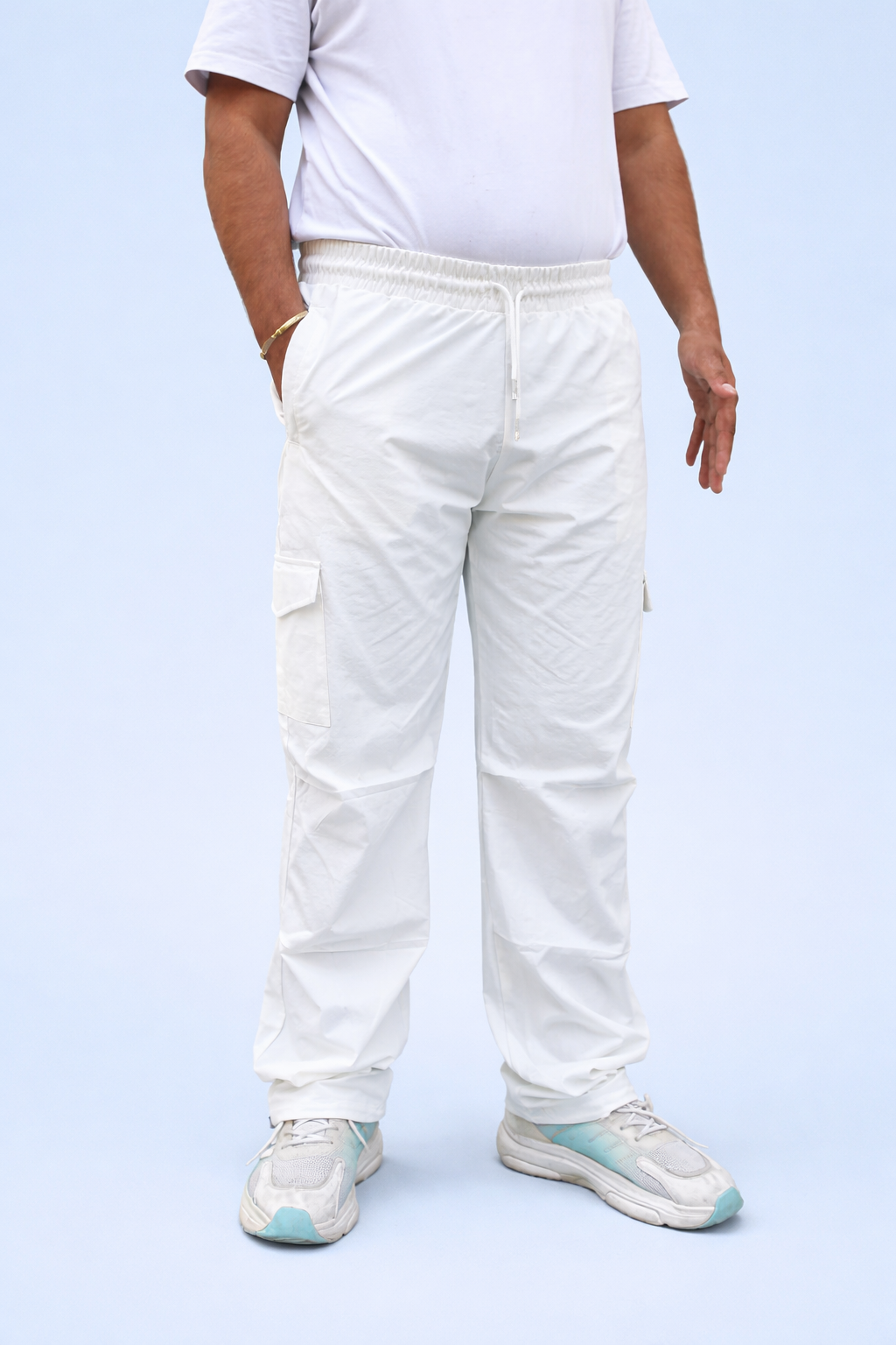 White cargo joggers with elastic waistband, cuff drawstring, and side cargo pockets