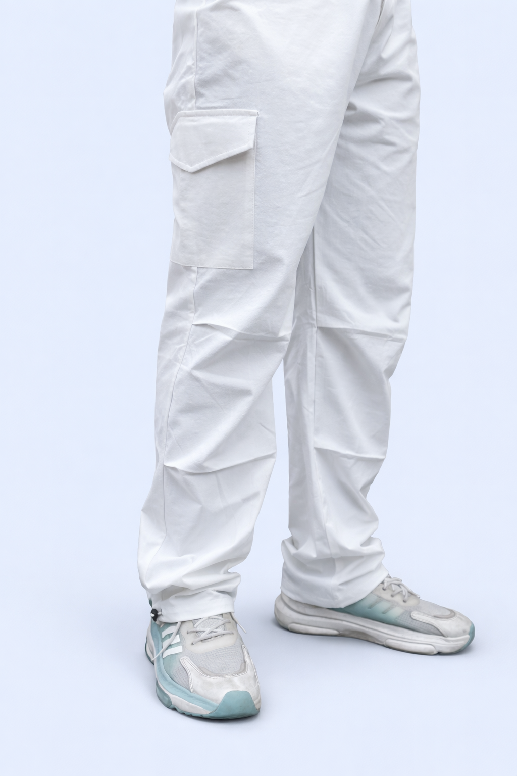 White cargo joggers with stacked cargo pockets at the leg and elastic ankle cuffs