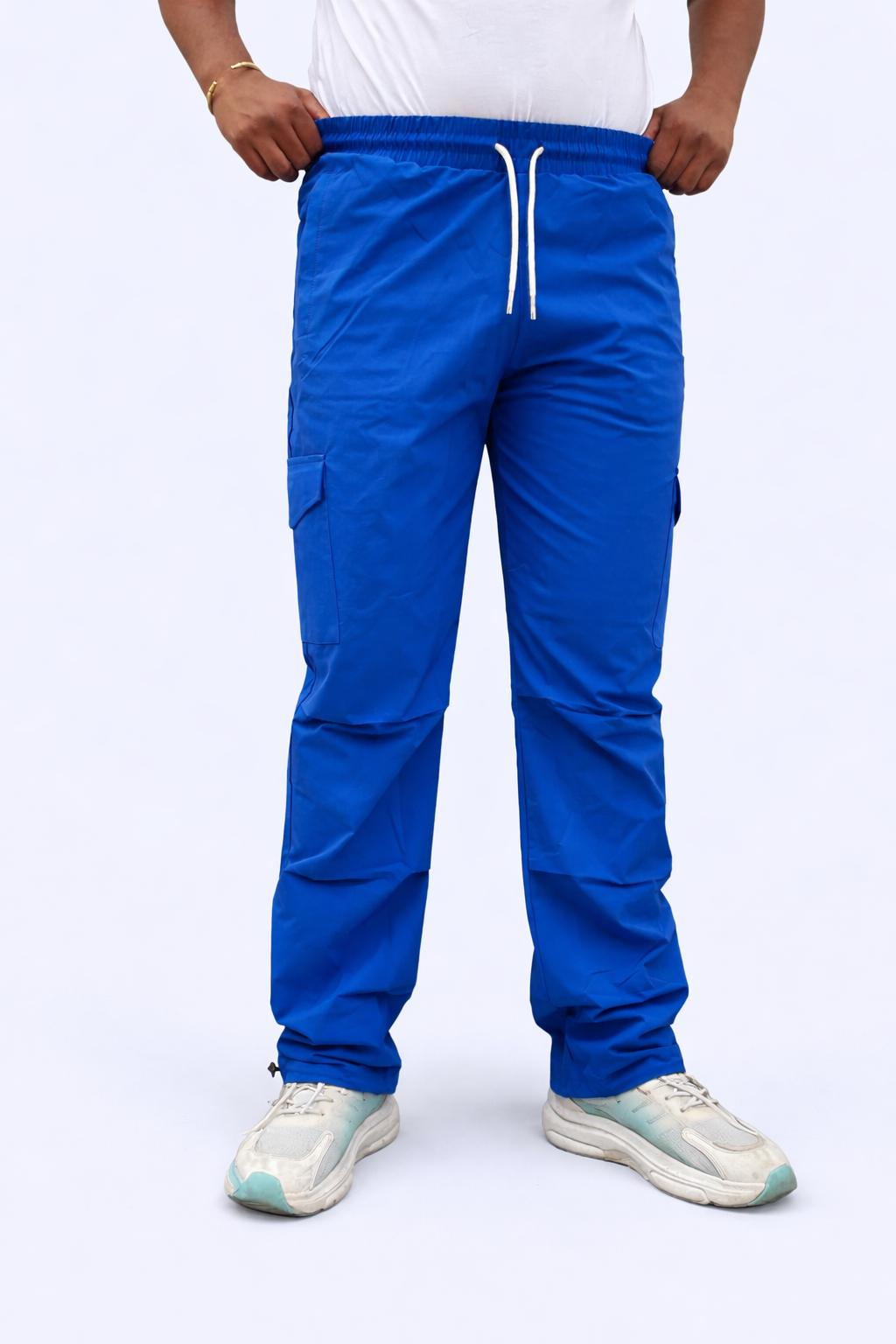 Blue cargo jogger pants with elastic waistband and white drawstring, front view