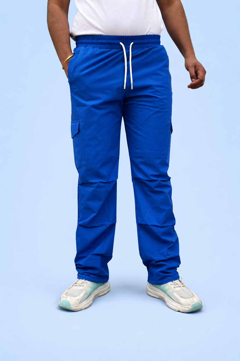 Blue cargo jogger pants with elastic waistband, drawstring, and cargo pockets, full view