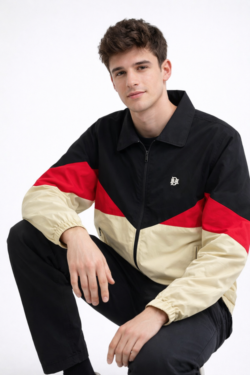 Color-block windbreaker jacket in black, red and sand; front zip and stand collar