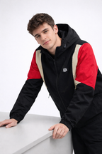 Black hooded windbreaker with red and sand multi-panel sleeves and chest, full zip front