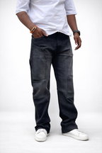 Men's dark charcoal cargo denim jeans, front view with multiple utility pockets