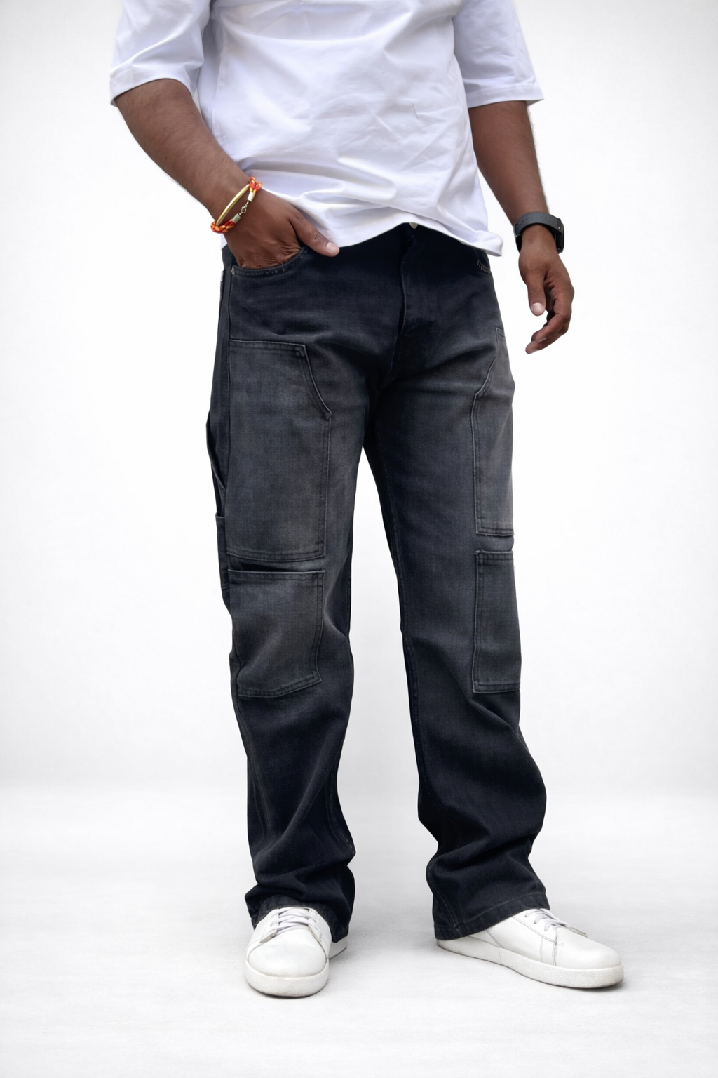 Men's dark charcoal cargo denim jeans, front view with multiple utility pockets