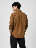 Men's dark ochre textured oxford shirt back view with yoke and buttoned collar