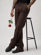 Men’s dark brown relaxed-fit structured pants with button closure and belt loops