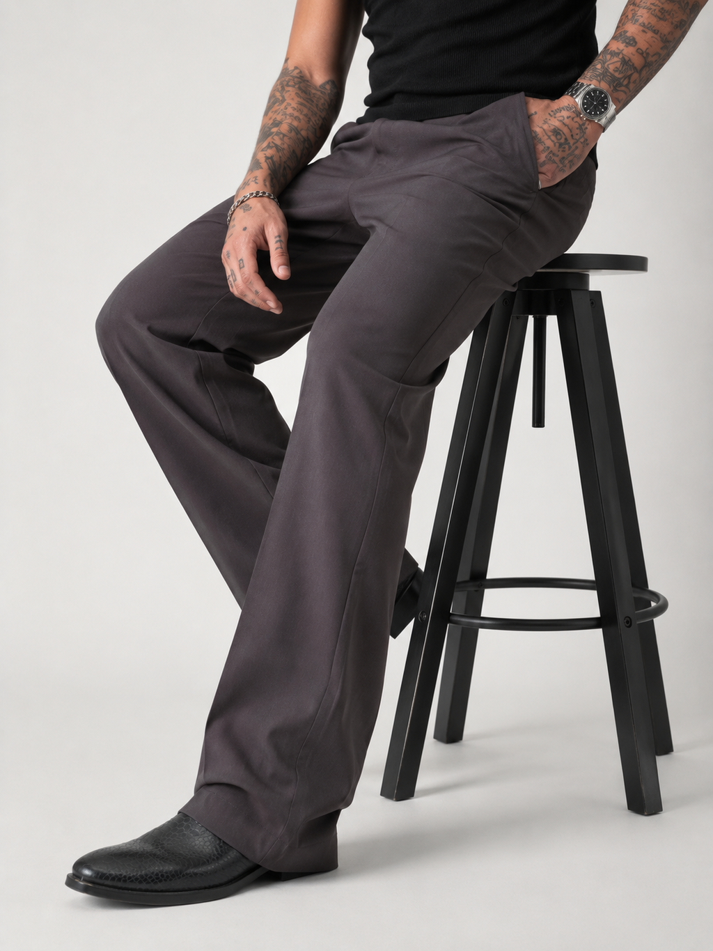 Dark taupe relaxed-fit structured Korean pants, back view with pleats and wide legs