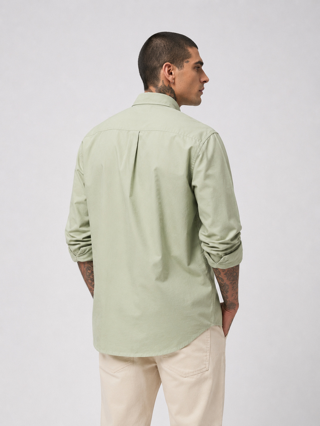 Sage green textured oxford button-up shirt from back view
