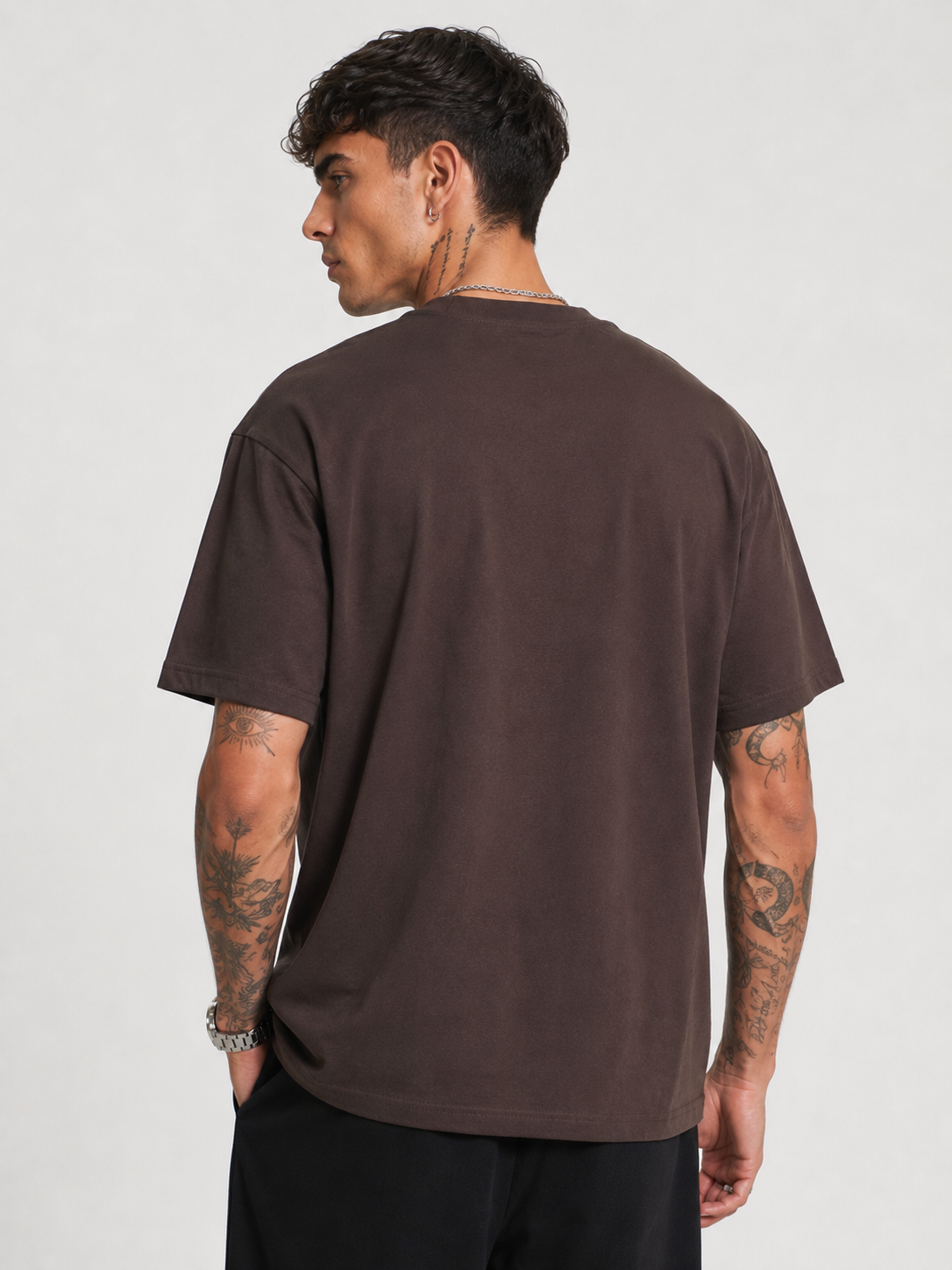 Dark chocolate relaxed motocross tee from back view with plain back and logo accents