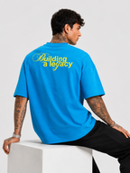 Blue drop-shoulder T-shirt with yellow back print and short sleeves