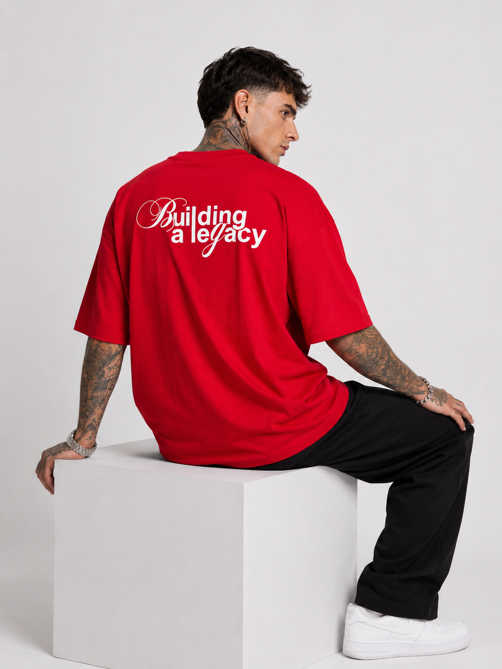 Scarlet red heavyweight drop-shoulder tee, back 'Building a legacy' print.