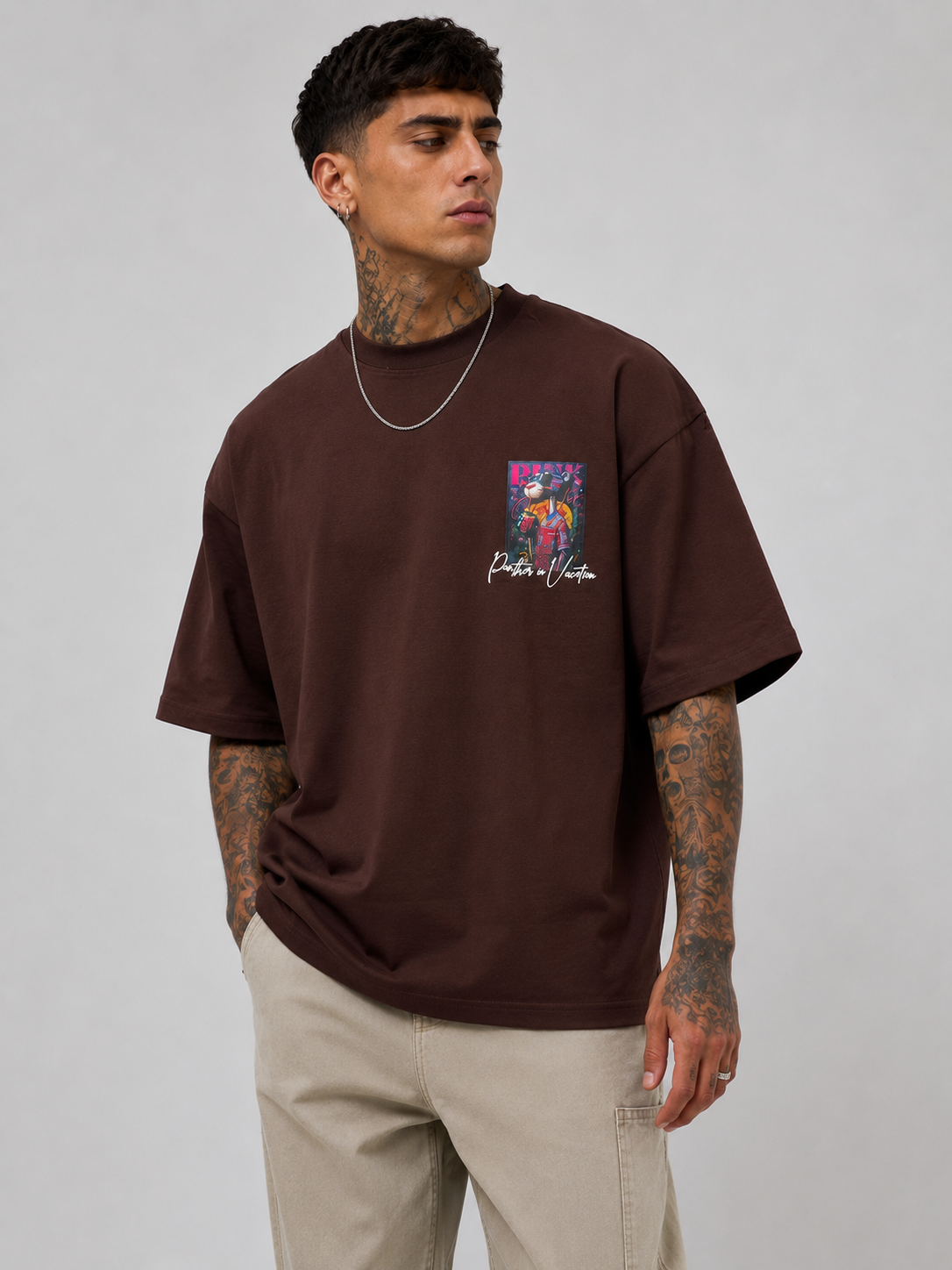 Cacao brown drop-shoulder T-shirt with small chest graphic and crew neckline
