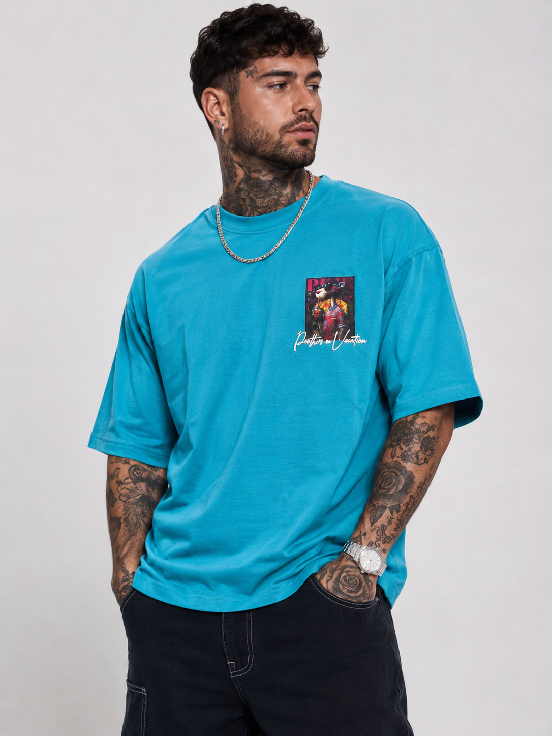 Cerulean blue drop-shoulder graphic shirt with small front chest logo