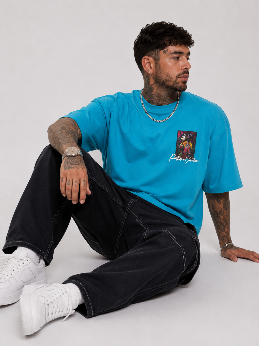 Cerulean blue drop-shoulder graphic shirt with small front chest print