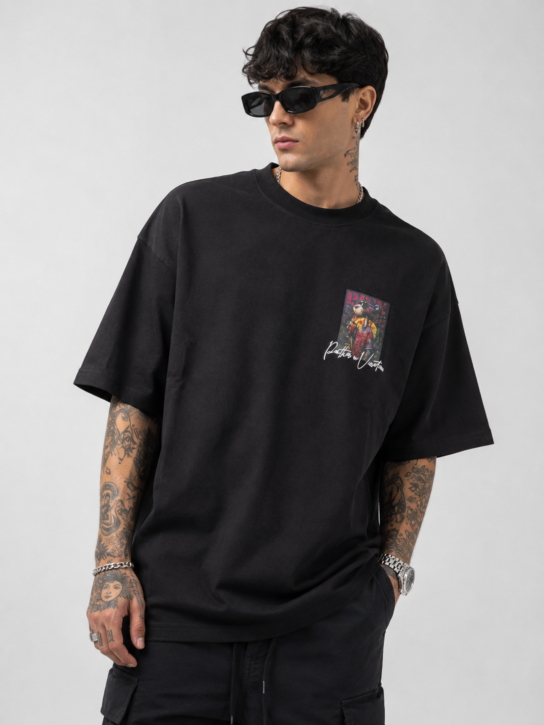 Matte black heavyweight drop-shoulder tee with small front graphic