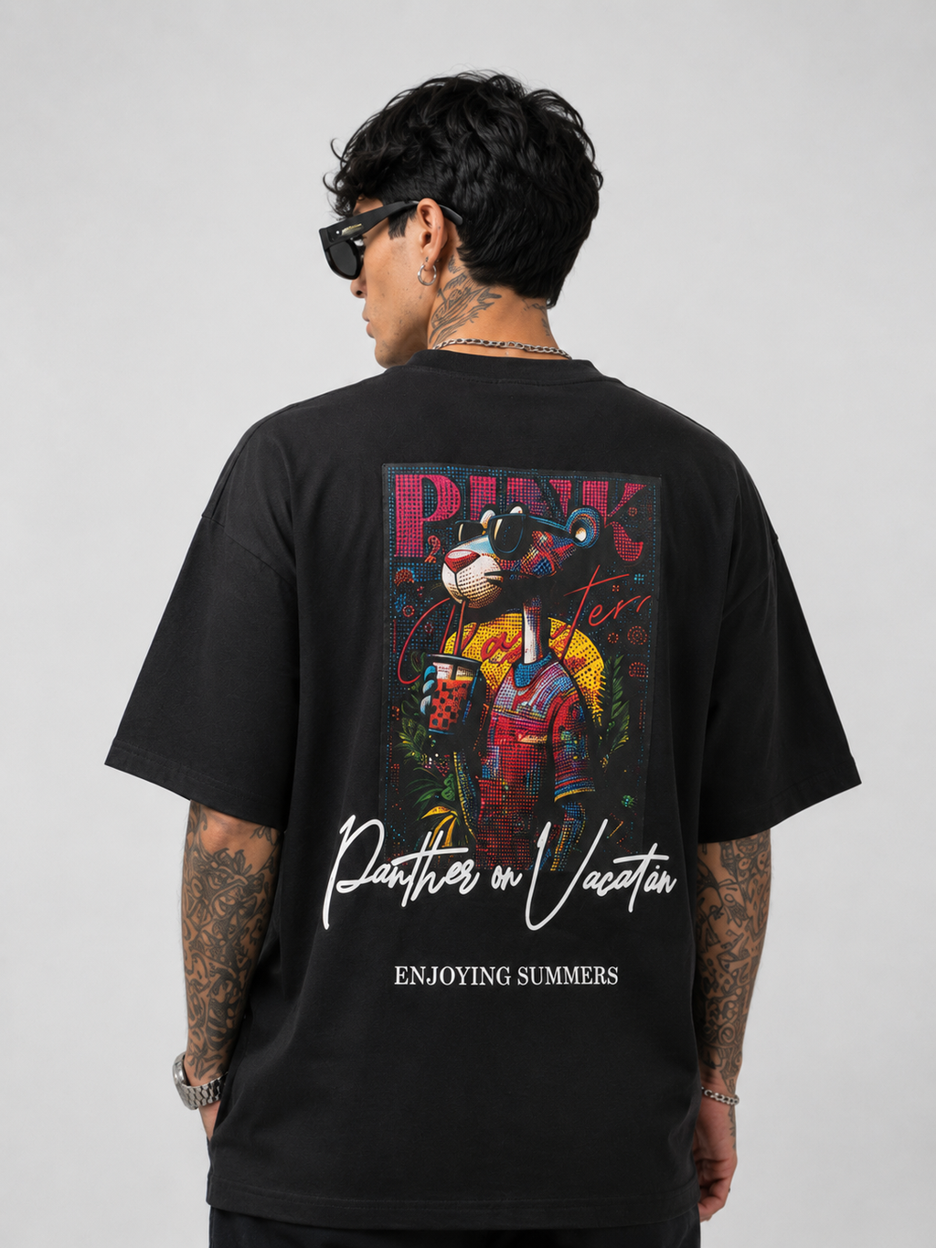 Matte black heavyweight drop-shoulder tee with large back graphic and text