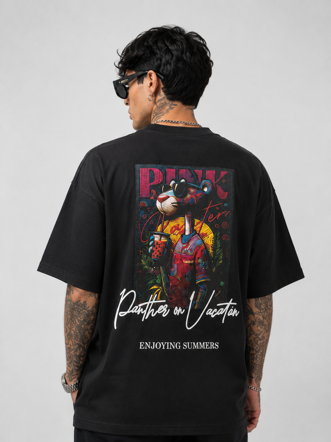 Matte black heavyweight drop-shoulder tee with large back graphic and text