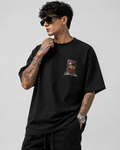 Matte black heavyweight drop-shoulder tee with colorful chest graphic