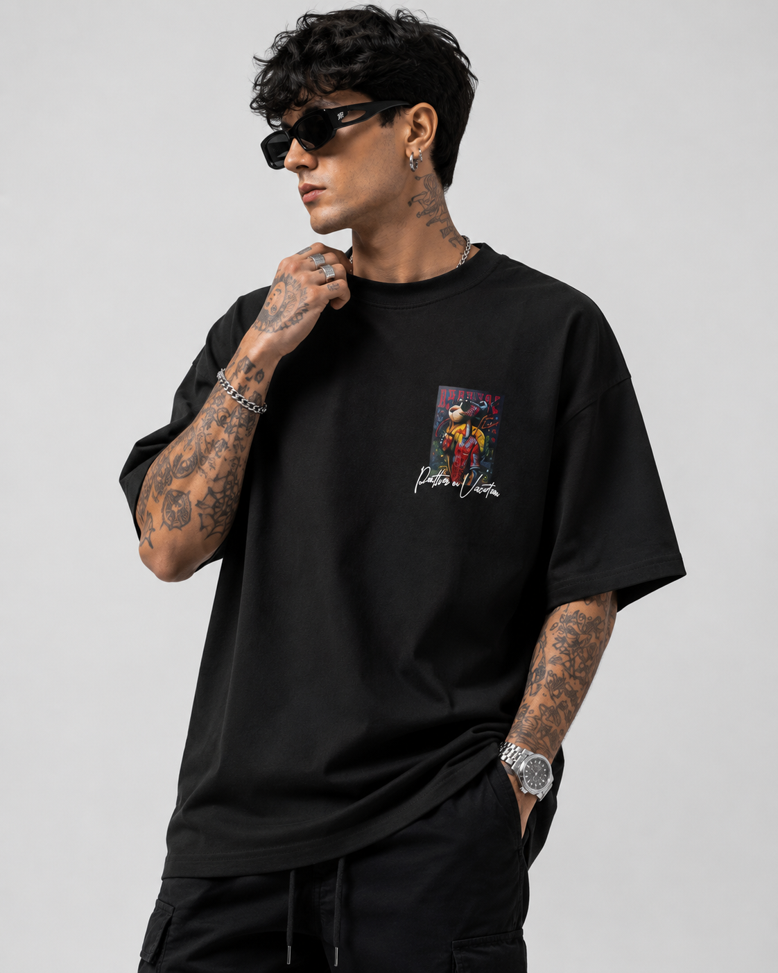 Matte black heavyweight drop-shoulder tee with colorful chest graphic