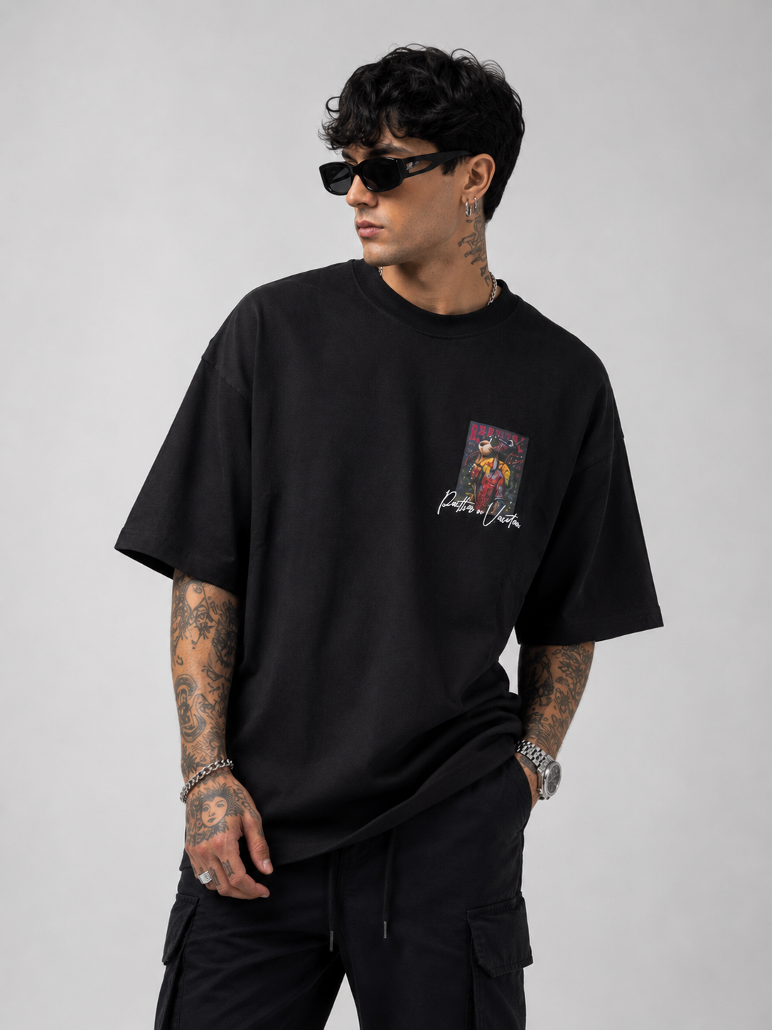 Matte black heavyweight drop-shoulder tee with front chest graphic
