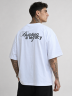 Off-white drop-shoulder T-shirt with "Building a legacy" back graphic