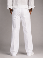 White linen straight-fit pants with patch front pockets and relaxed waistband