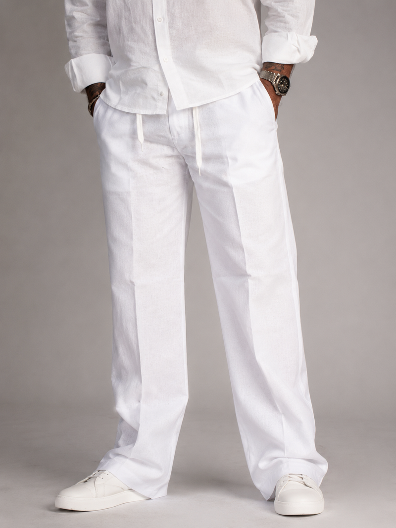 White linen straight-fit pants with drawstring waistband and side seams